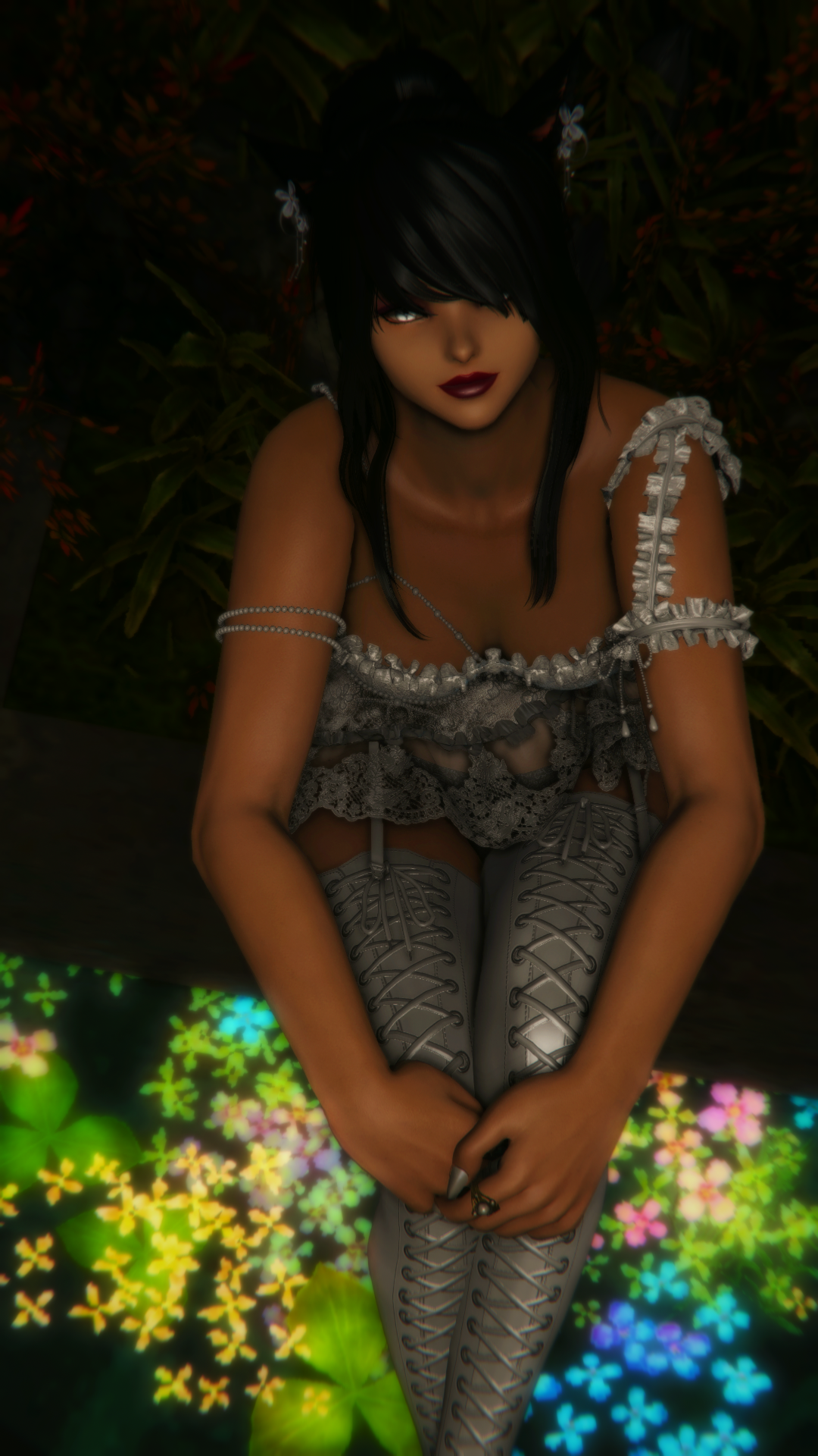 Woowind seated above glowing petals in silver lace attire